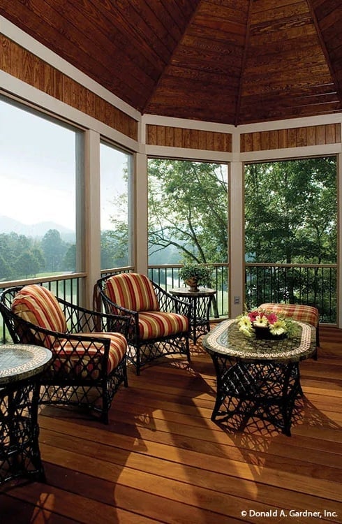 Wicker Chairs, Striped Cushions, and a Screened Porch That Earns Its Square Footage