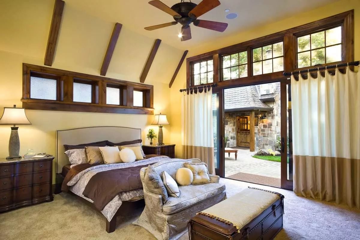 Exposed Beams and a Sliding Glass Wall Turn This Bedroom Into Something Rare