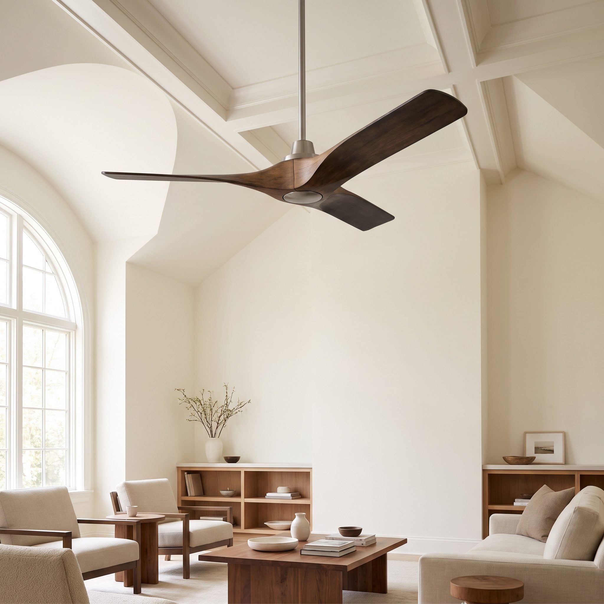Open-plan living room with a single 52-inch matte black ceiling fan centered over an 84-inch leather sofa as the only