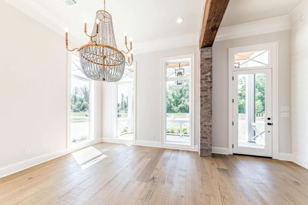 Beaded Chandelier and Exposed Brick Column Earn Every Inch of Attention Here