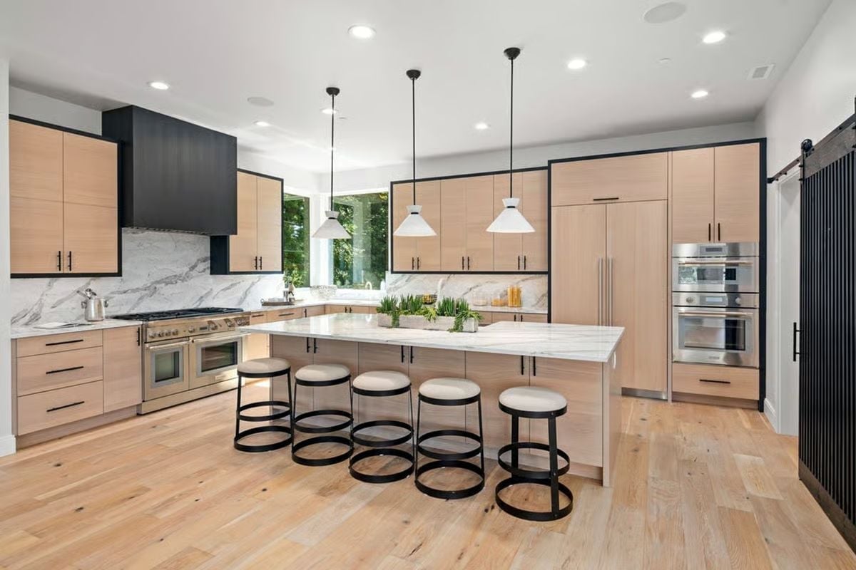 Light Wood and Marble Pull Off the Two-Tone Kitchen Without Trying Too Hard