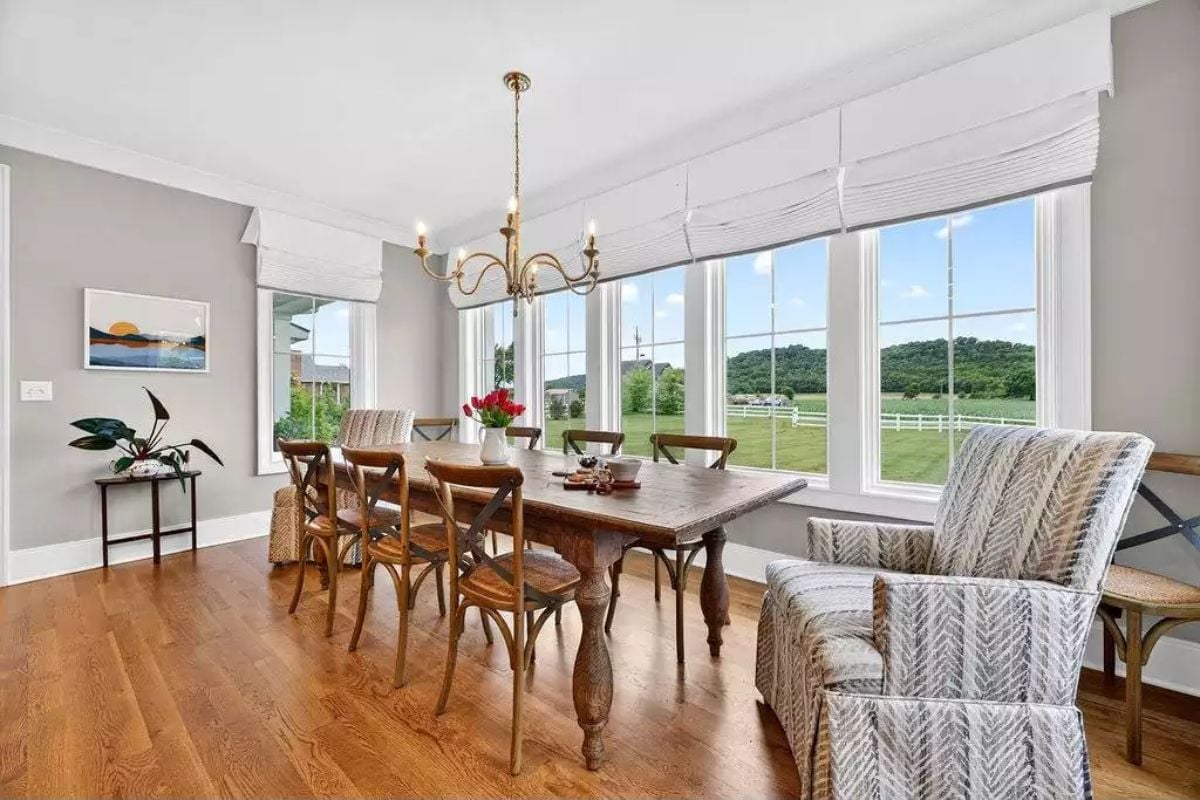 Farmhouse Dining Room with a View That Competes with Everything on the Table