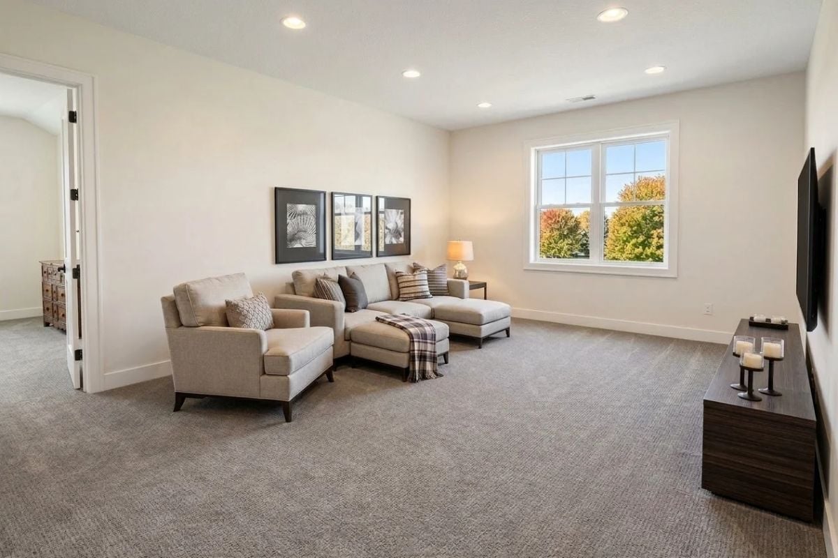 Sectional, Armchair, and Enough Carpet to Make the Kids Want to Roll Around on It
