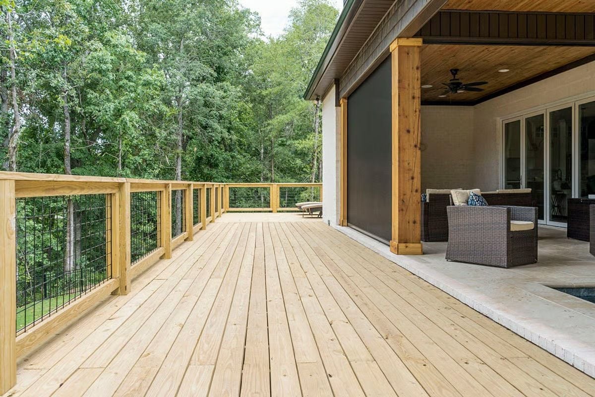 Hog Wire Railings and Pressure-Treated Framing With a Forest That Does All the Work