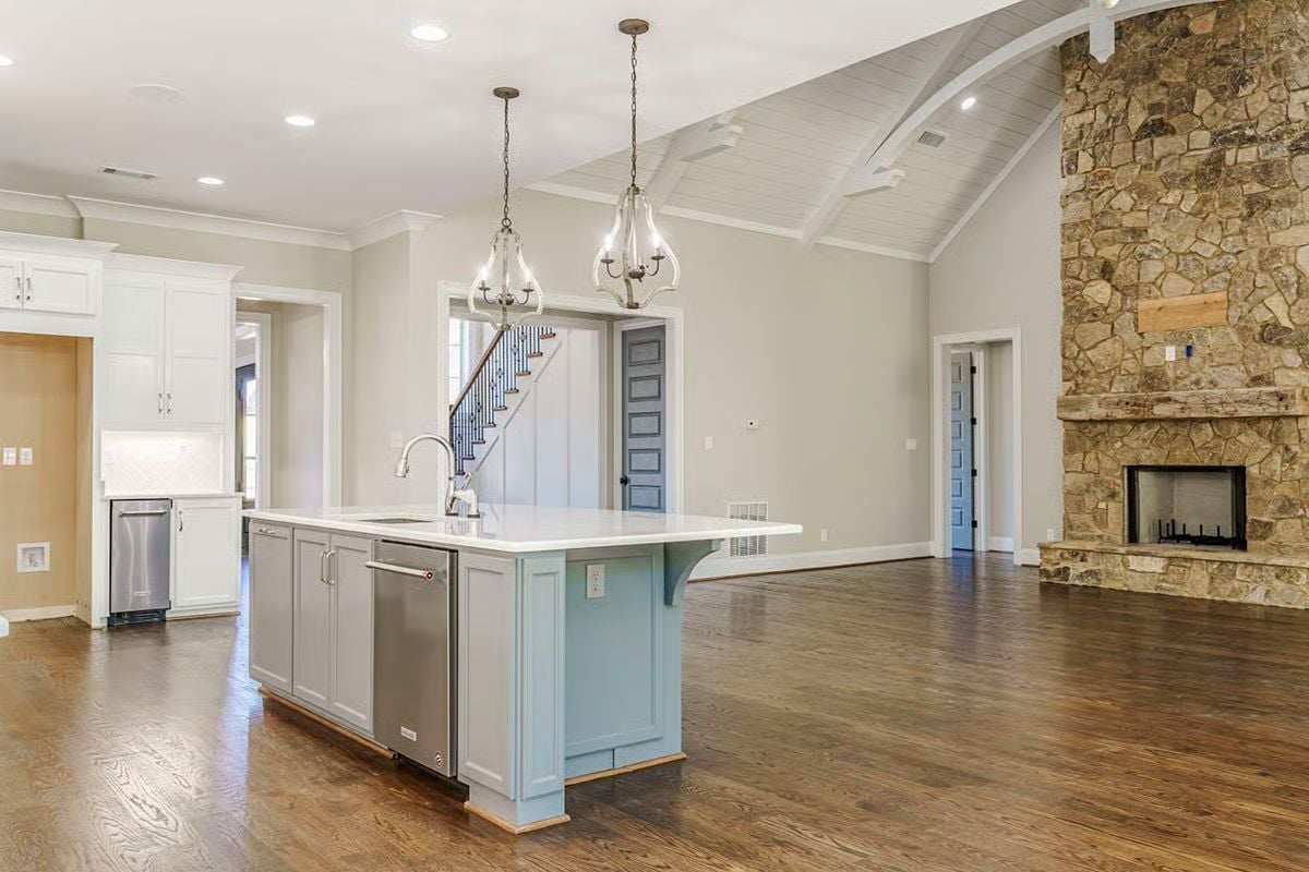 Vaulted Ceiling, Stone Fireplace, and an Island That Earns Its Square Footage