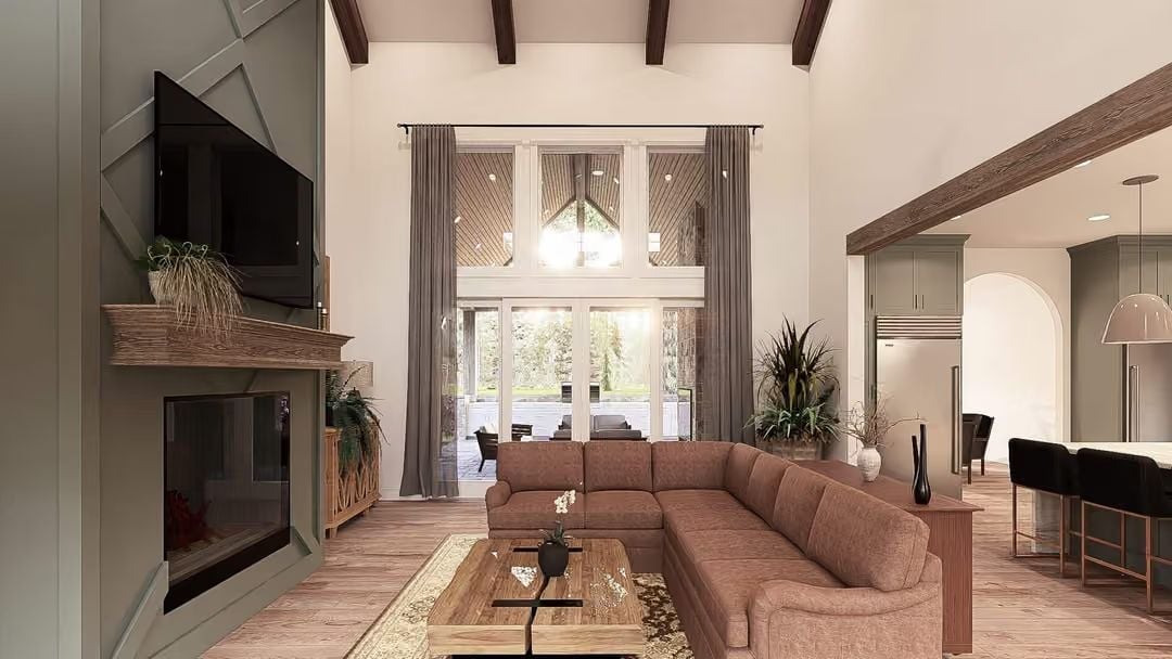 Cathedral Ceilings, Dark Timber Beams, and a Sectional That Means Business