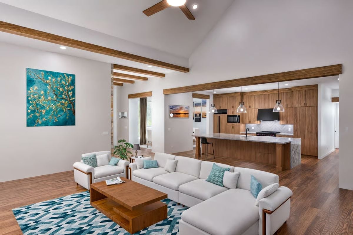 Exposed Beams, White Sofas, and a Kitchen That Doesn't Hide