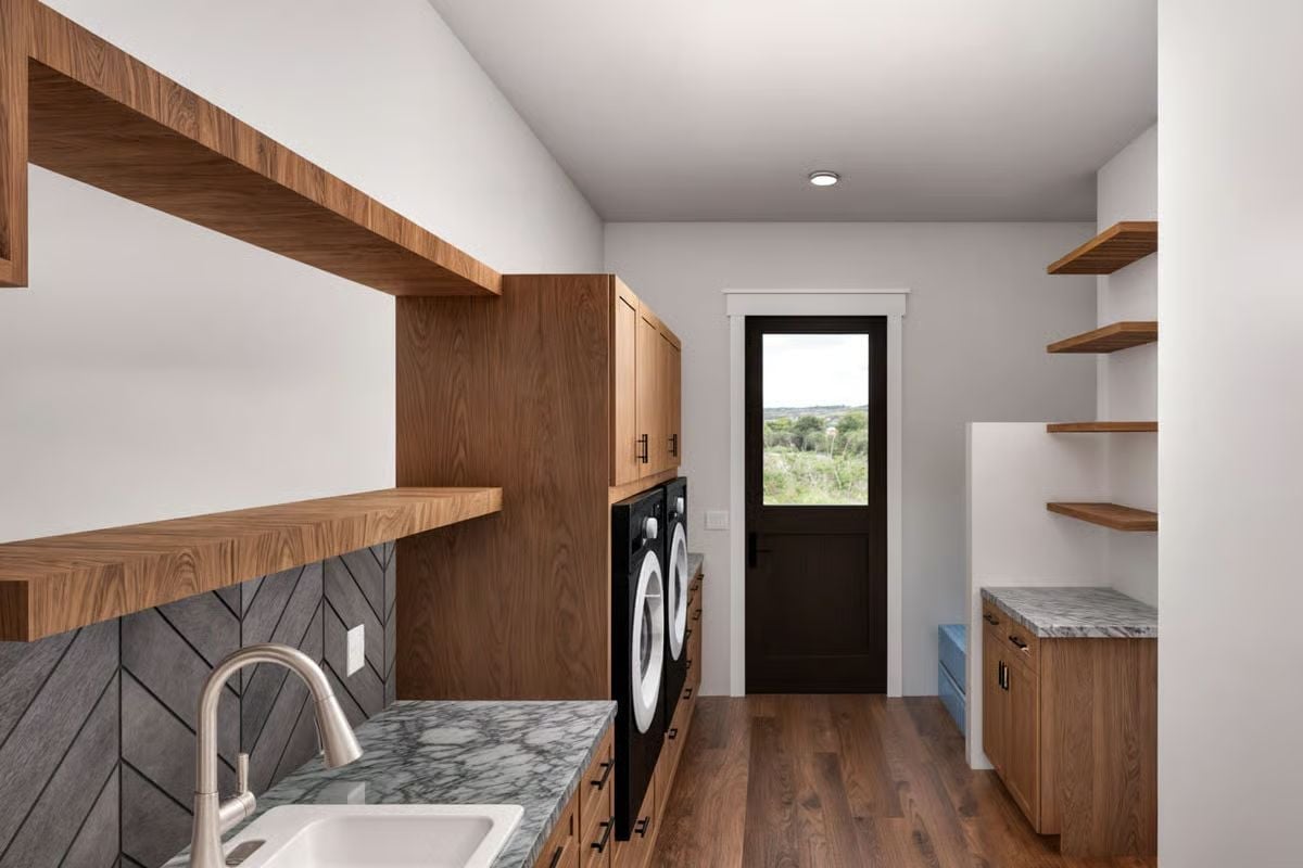 Walnut Shelving, Chevron Tile, and a Laundry Room Built to Pull Its Weight