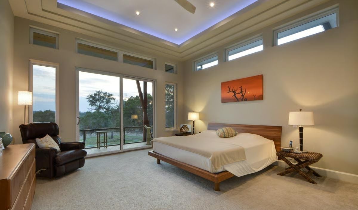 Purple Cove Ceiling and a Low Walnut Bed That Resets the Whole Room's Pitch