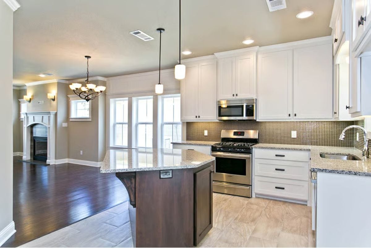 Pendant Lights Over the Island Earn Their Keep When the Chandelier Can't Reach