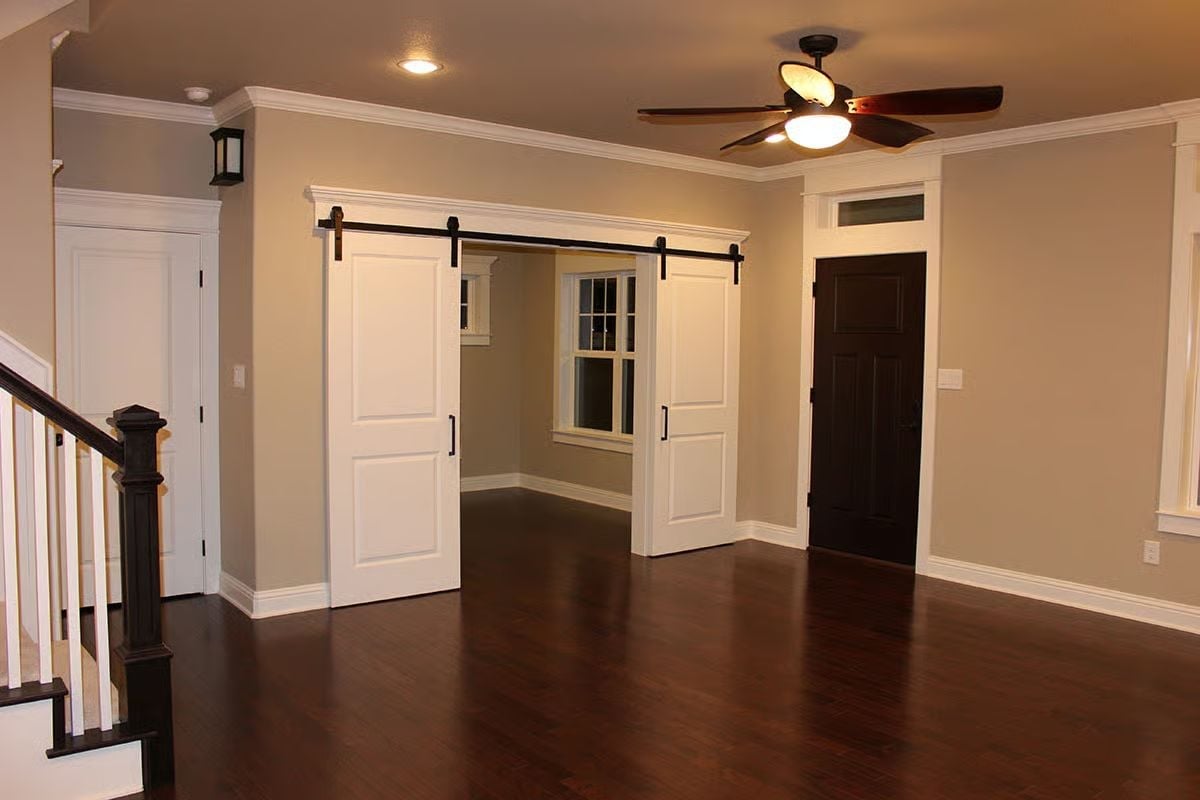 Sliding Barn Doors on a Black Rail Add an Unexpected Move to This Open Layout