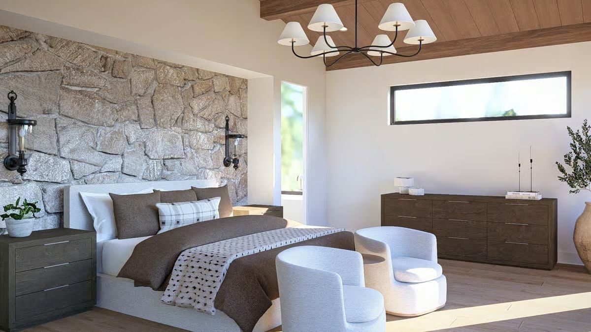 Granite Stone Accent Wall and Barrel Chairs That Make a Bedroom Feel Like a Lodge Suite