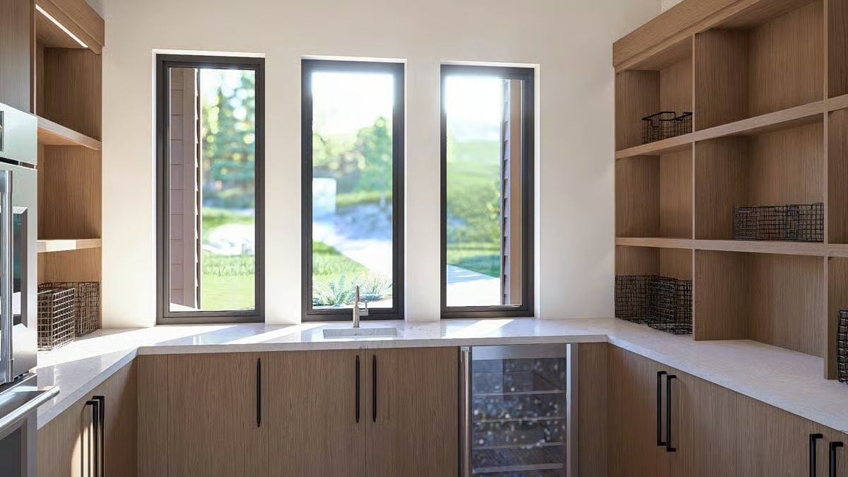 Walkout Wet Bar With a Wine Cooler Built Right Into the Cabinetry