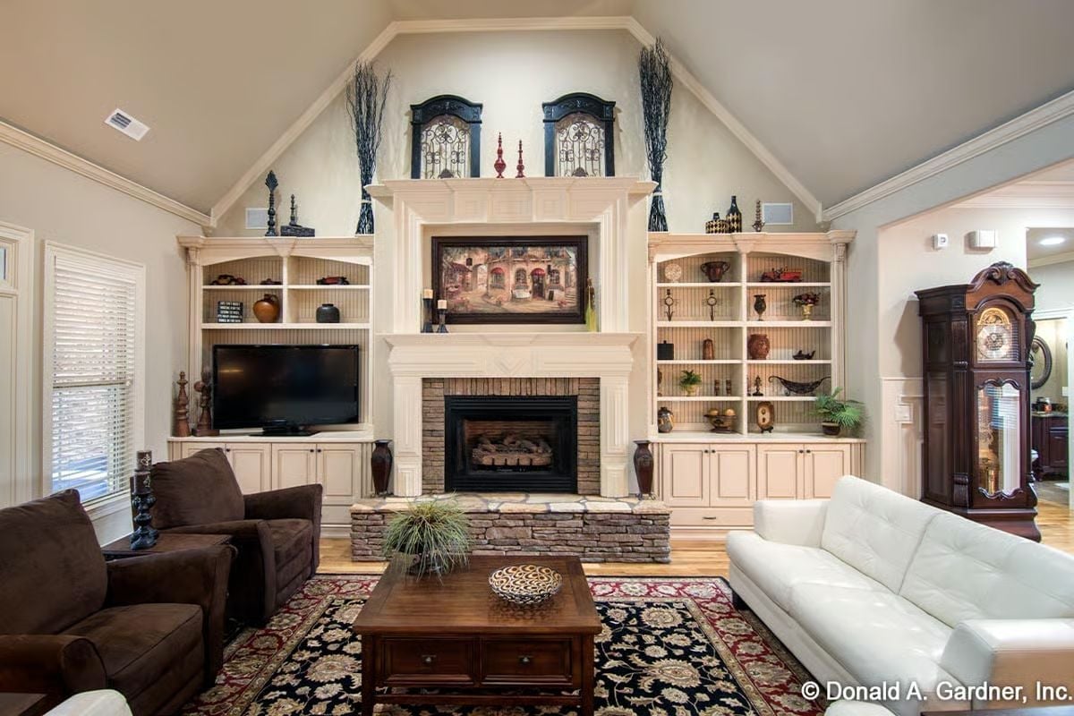 Built-Ins Flanking a Stone Fireplace Are the Whole Reason People Stay Too Long