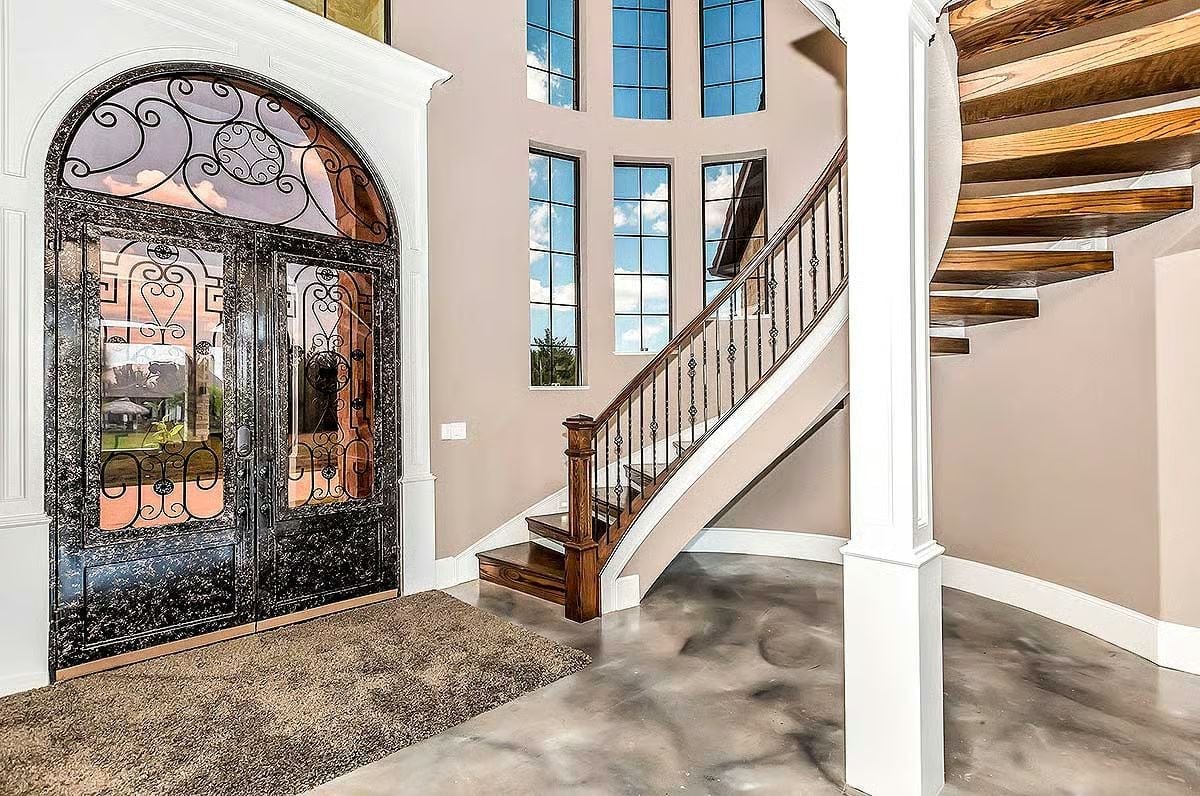 Iron, Glass, and Wood Walk Into a Foyer — Wait, No Em-Dashes Allowed. Let's Try Again. Let me redo that heading: