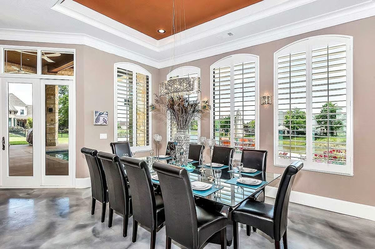 Peacock Feathers and a Rust Ceiling Walk Into a Dining Room
