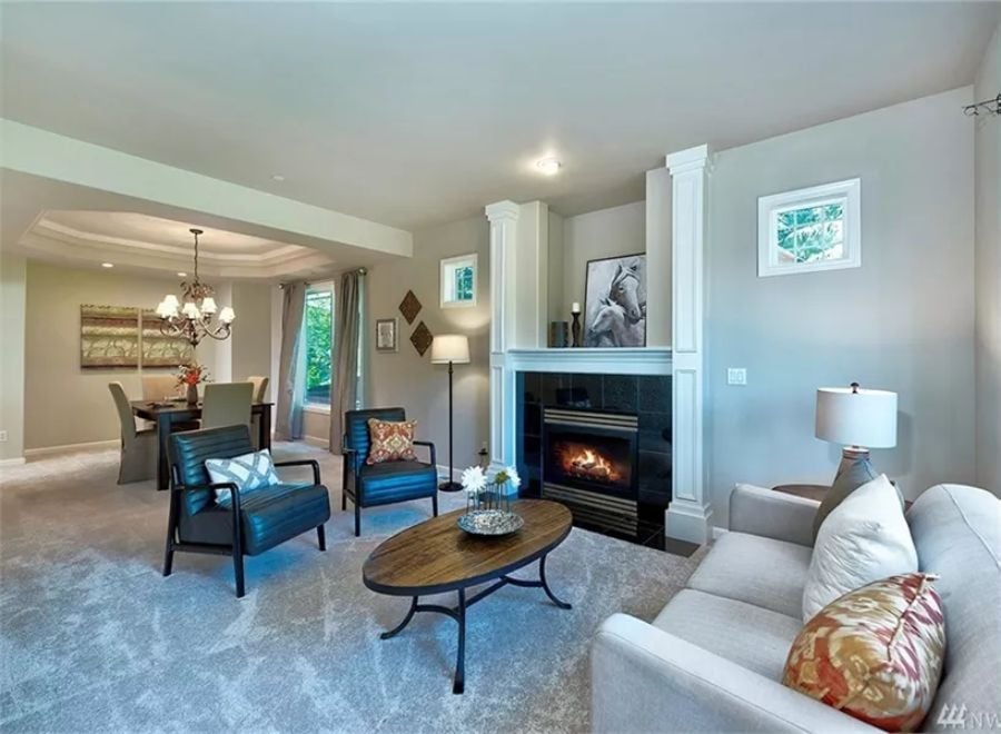 Fireplace With Flanking Columns Anchors the Open Living Area