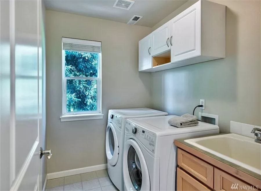 Folding Laundry Next to a Utility Sink Is a Small Luxury That Adds Up Fast