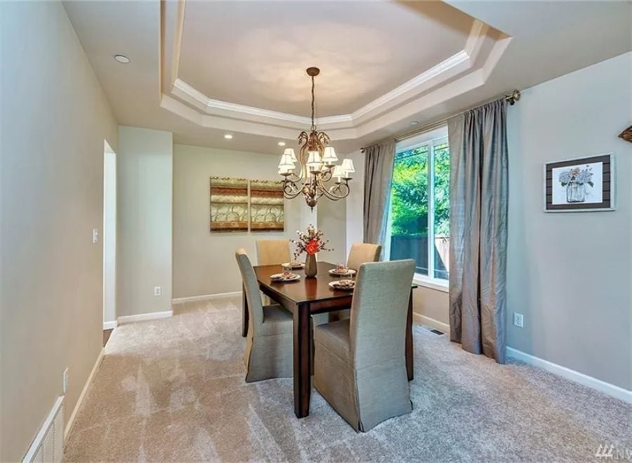 Tray Ceiling and Chandelier Give This Dining Room Its Formal Backbone