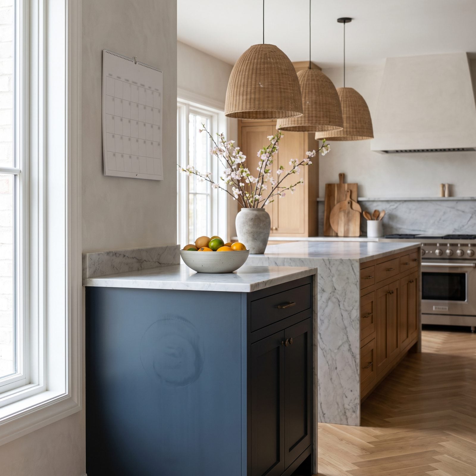 White shaker kitchen with a faint print on a cabinet edge and a felt bumper stuck to a door closed too soon.
