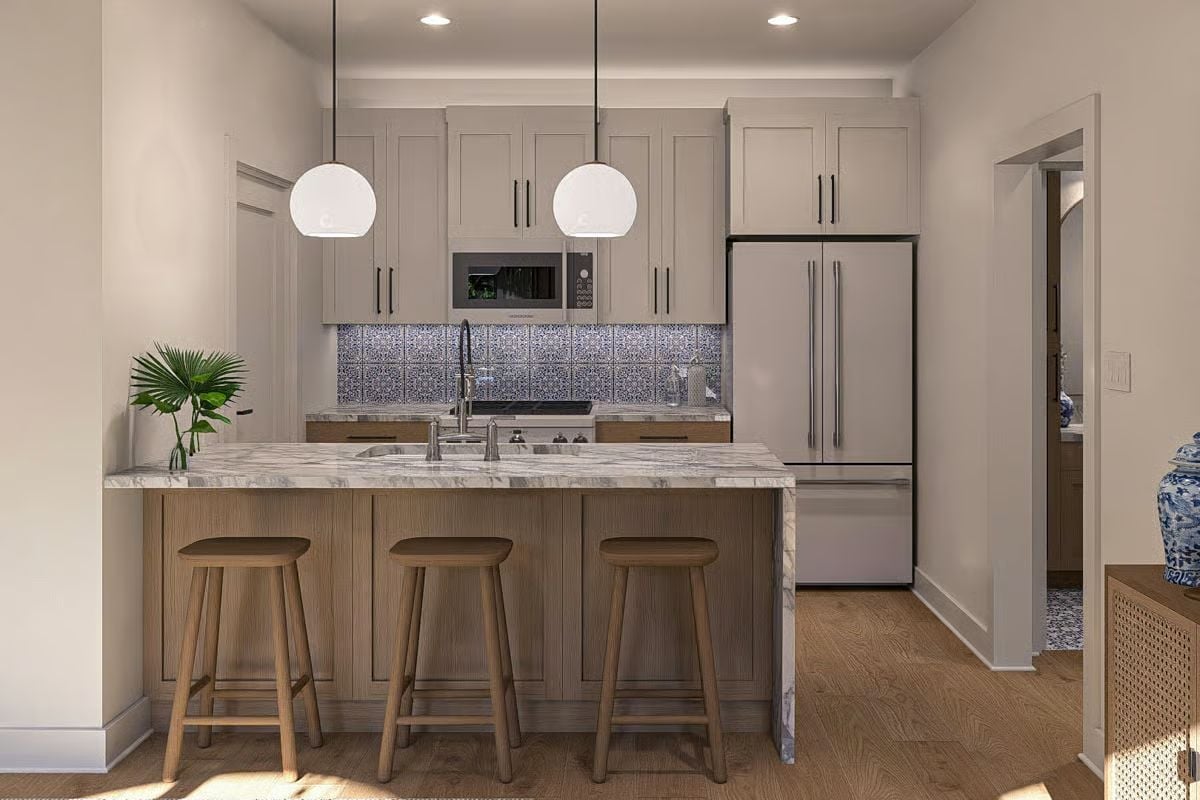 Marble Counters and a Blue Tile Backsplash Do the Heavy Lifting Here