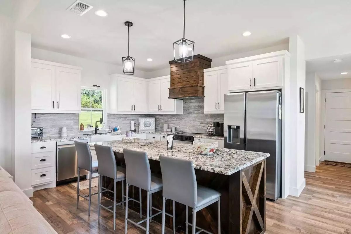 Wood-Wrapped Range Hood Anchors a Kitchen That Knows What It Is