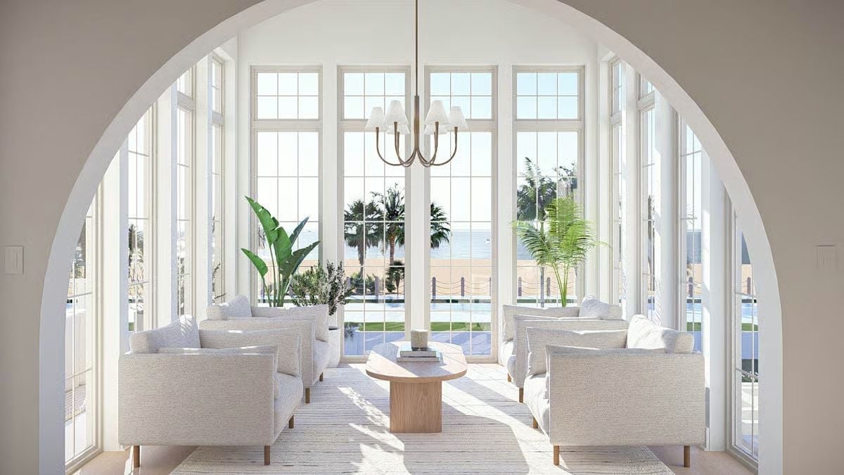 Arched Entry, Grid Windows, and a Sitting Room That Faces the Water