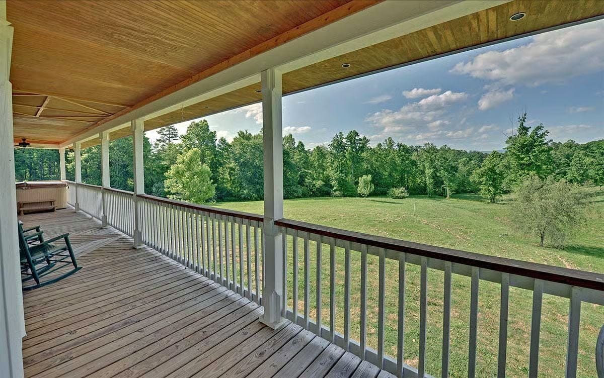 Long Porch, Rocking Chairs, and a Yard That Earns Its Keep