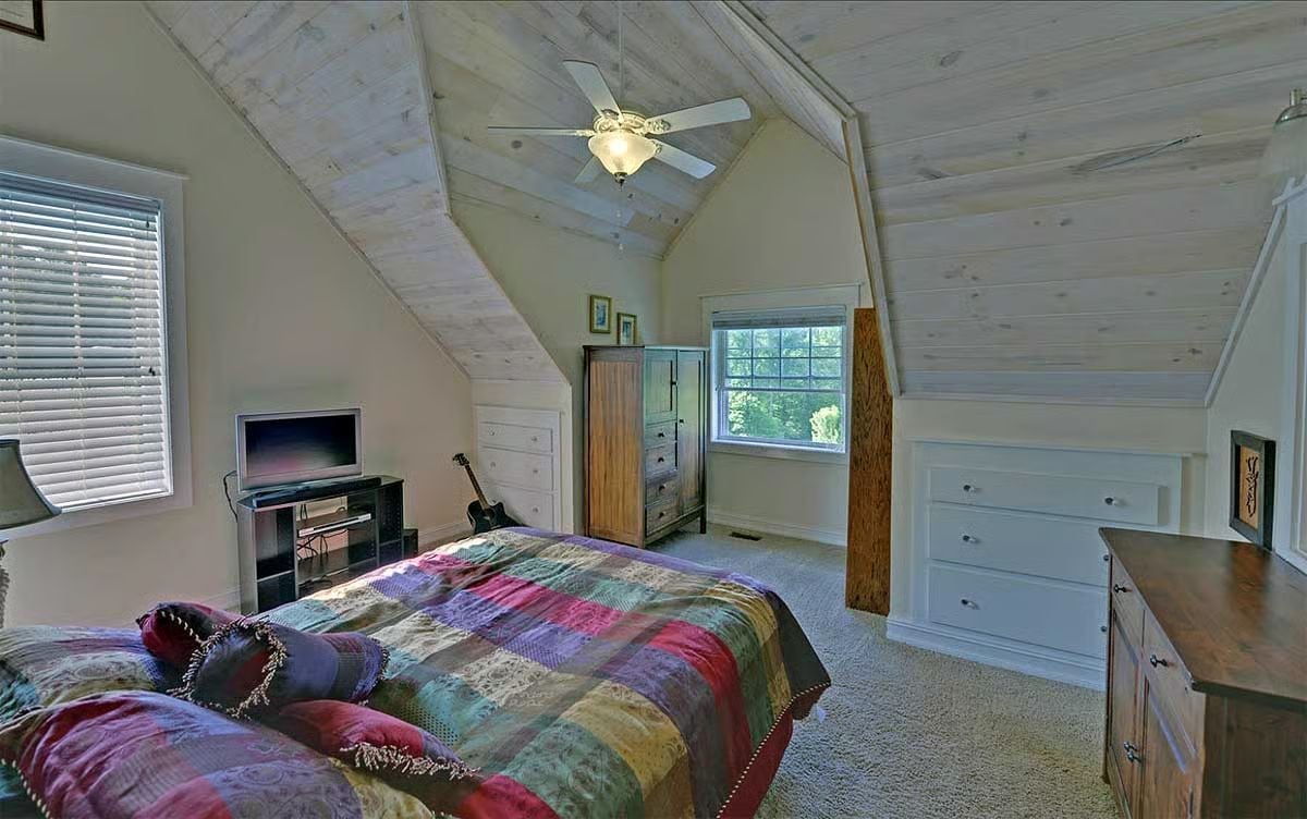 Whitewashed Rafters and a Patchwork Quilt That Owns the Room