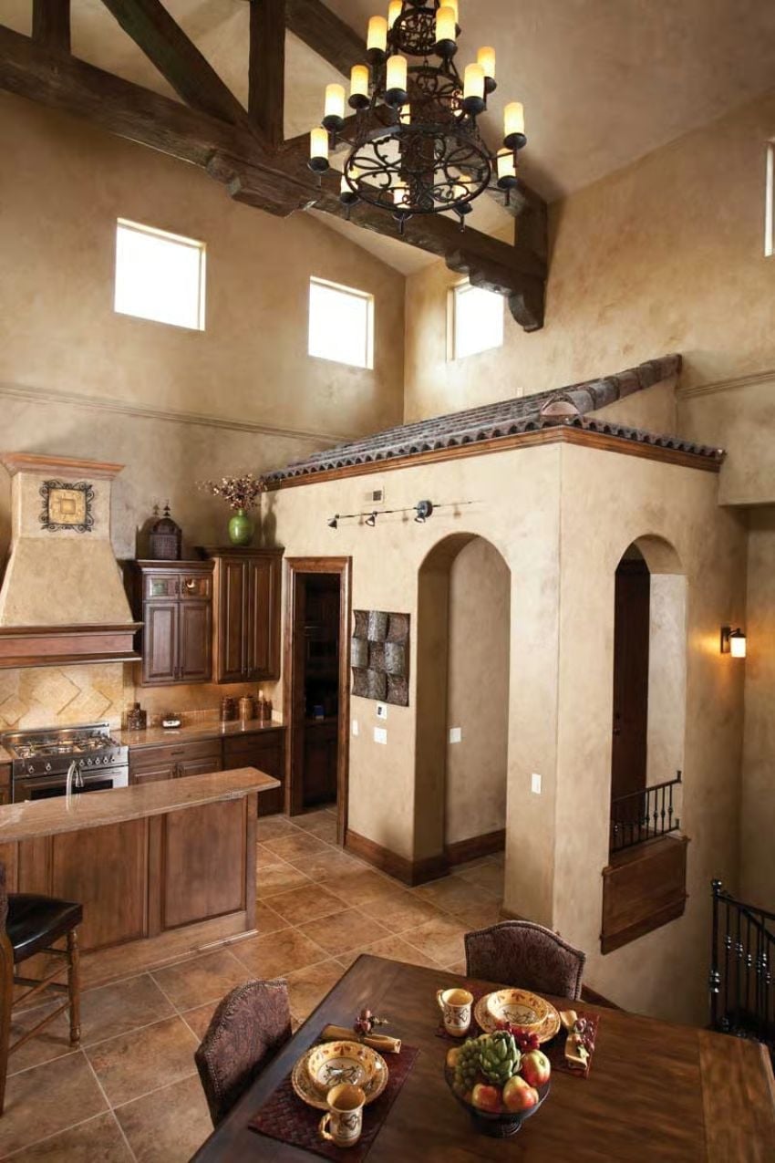 Wrought Iron Chandelier and Arched Plaster Tower Set the Tone for the Whole House