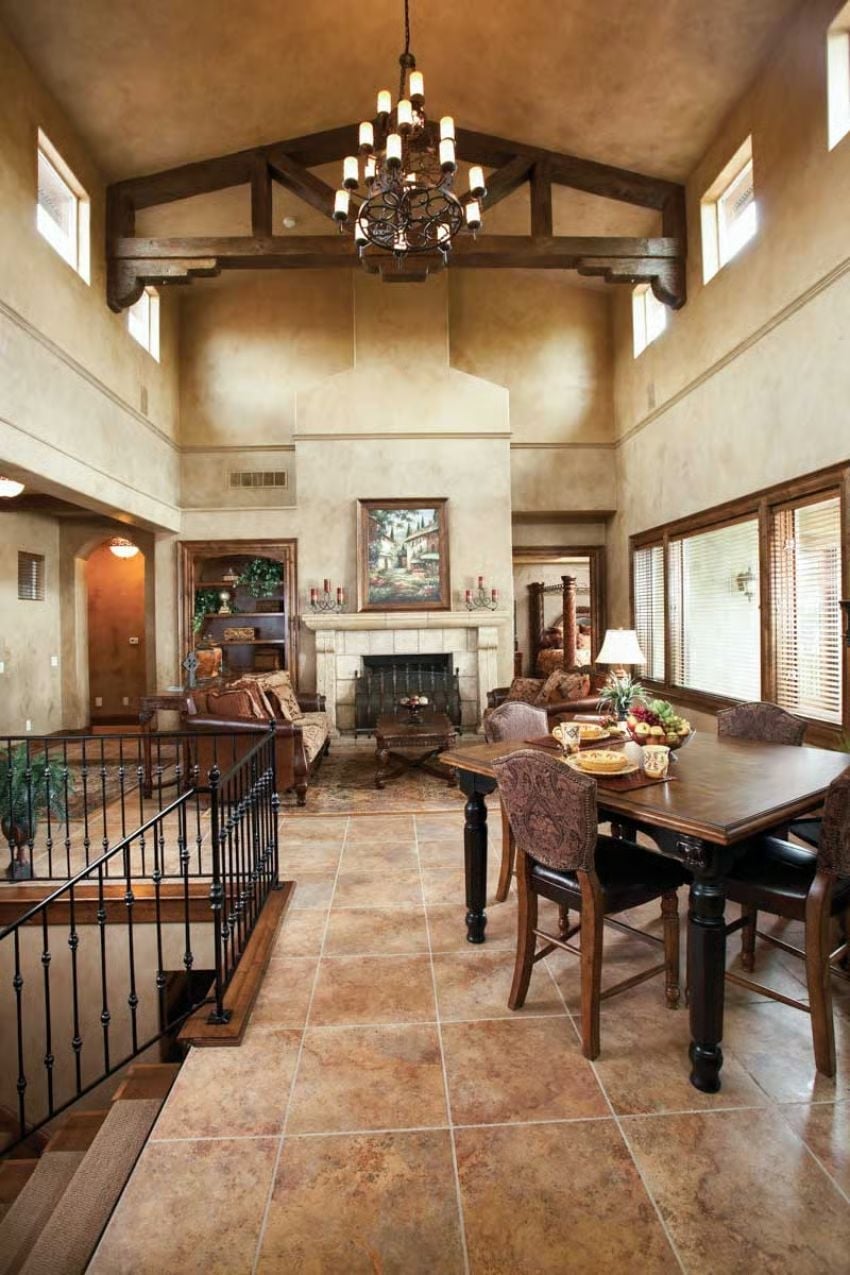 Wrought Iron, Exposed Beams, and a Fireplace That Earns Its Place on the Wall