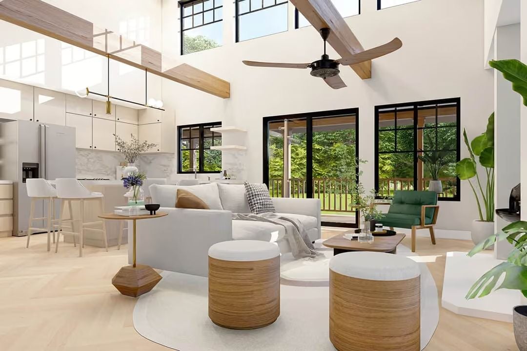 Vaulted Ceiling, Oval Rug, and Two Ottomans That Do All the Heavy Lifting
