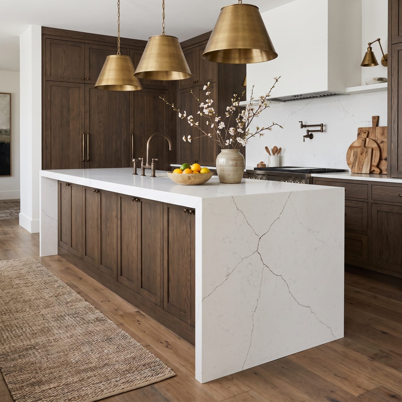White quartz seating overhang extending unsupported past the cabinet with a hairline crack near the corner.