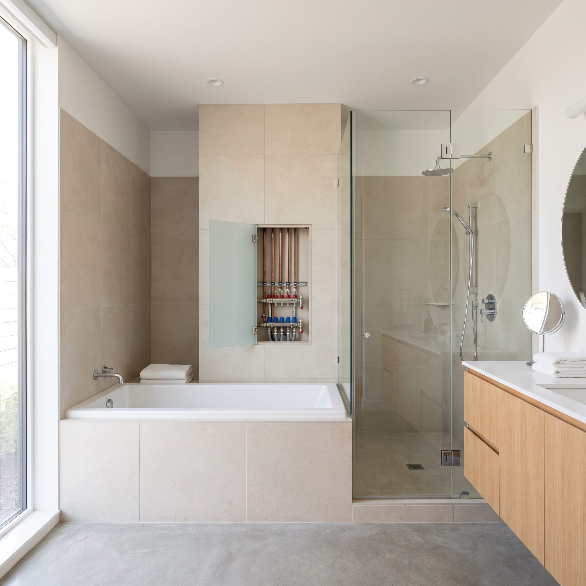 Use a Plumbing Wall Shared by Both Tub and Shower