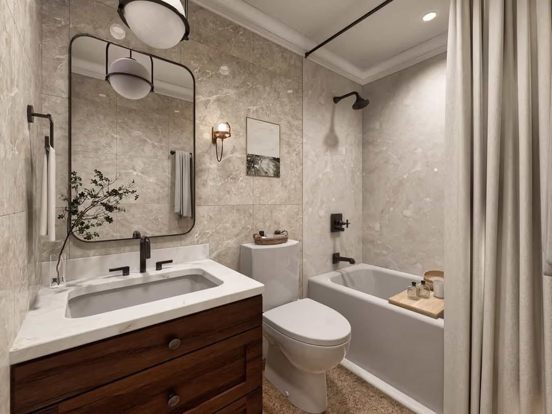 Marble Counters, Dark Faucets, and a Wood Vanity That Earns Its Keep