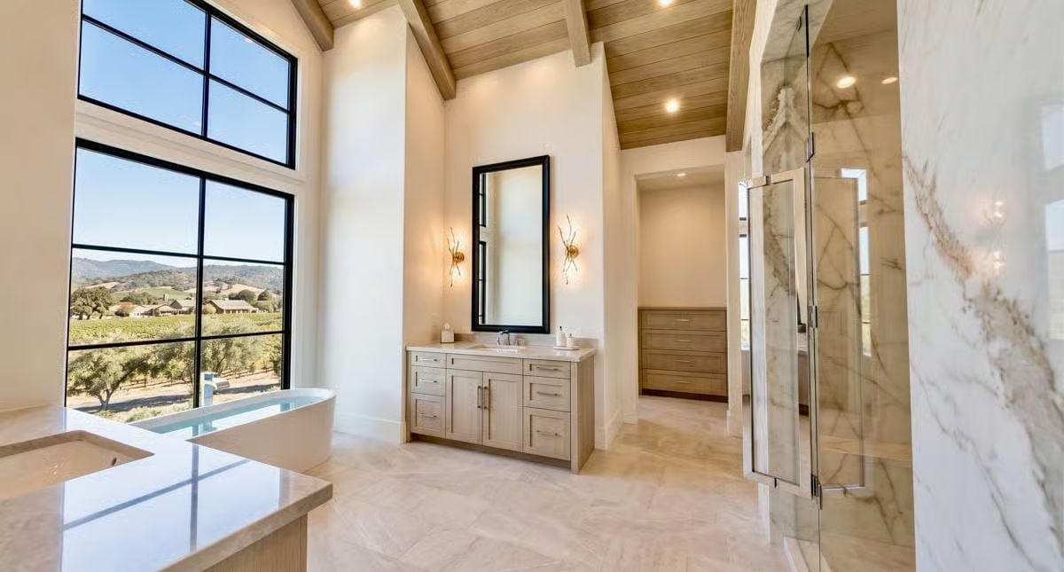 Marble Shower Walls and Vineyard Views Make This Primary Bath Hard to Leave