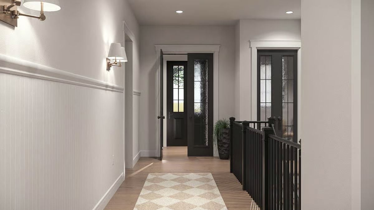 Beadboard Wainscoting and Black Doors Make a Quiet Statement Upstairs