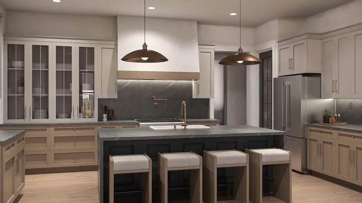 Copper Pendants and Dark Stone Pull the Kitchen's Two Halves Together