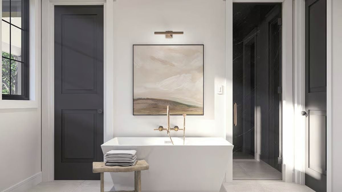 Gold Faucetry and a Landscape Painting Turn Bath Night Into Something Worth Anticipating