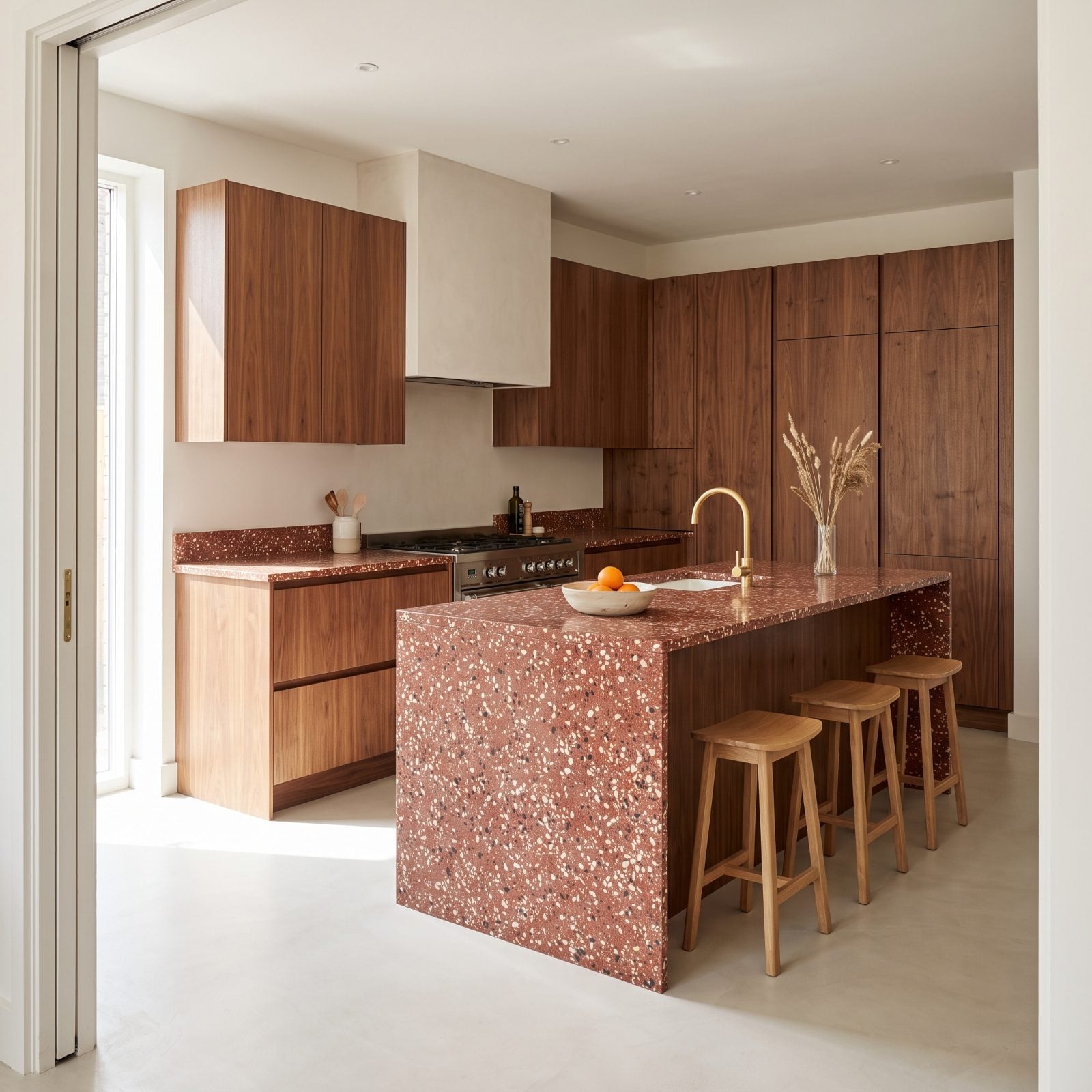 Walnut Slab Cabinets With Red Terrazzo Worktops