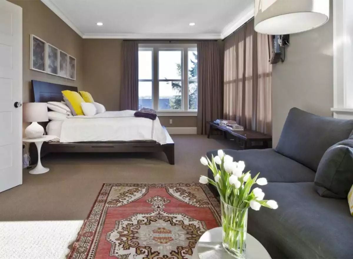 Yellow Pillows and a Persian Runner Earn Their Keep Against All That Taupe