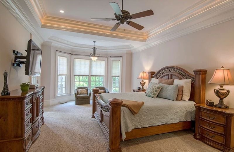 Tray Ceiling with Cove Lighting Earns Its Keep in a Room This Proportioned