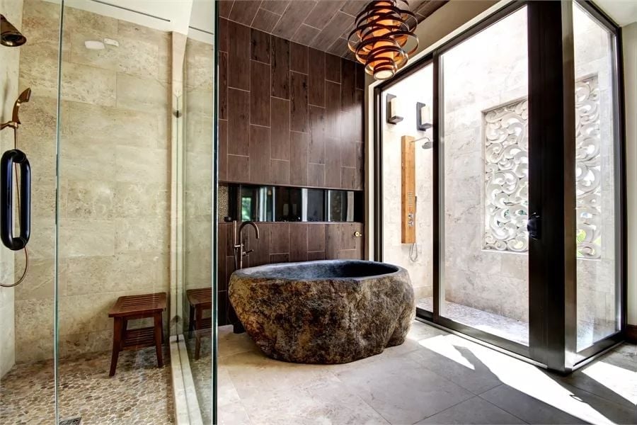 Carved Stone Tub, Spiral Pendant, and a Bath Built Around One Centerpiece