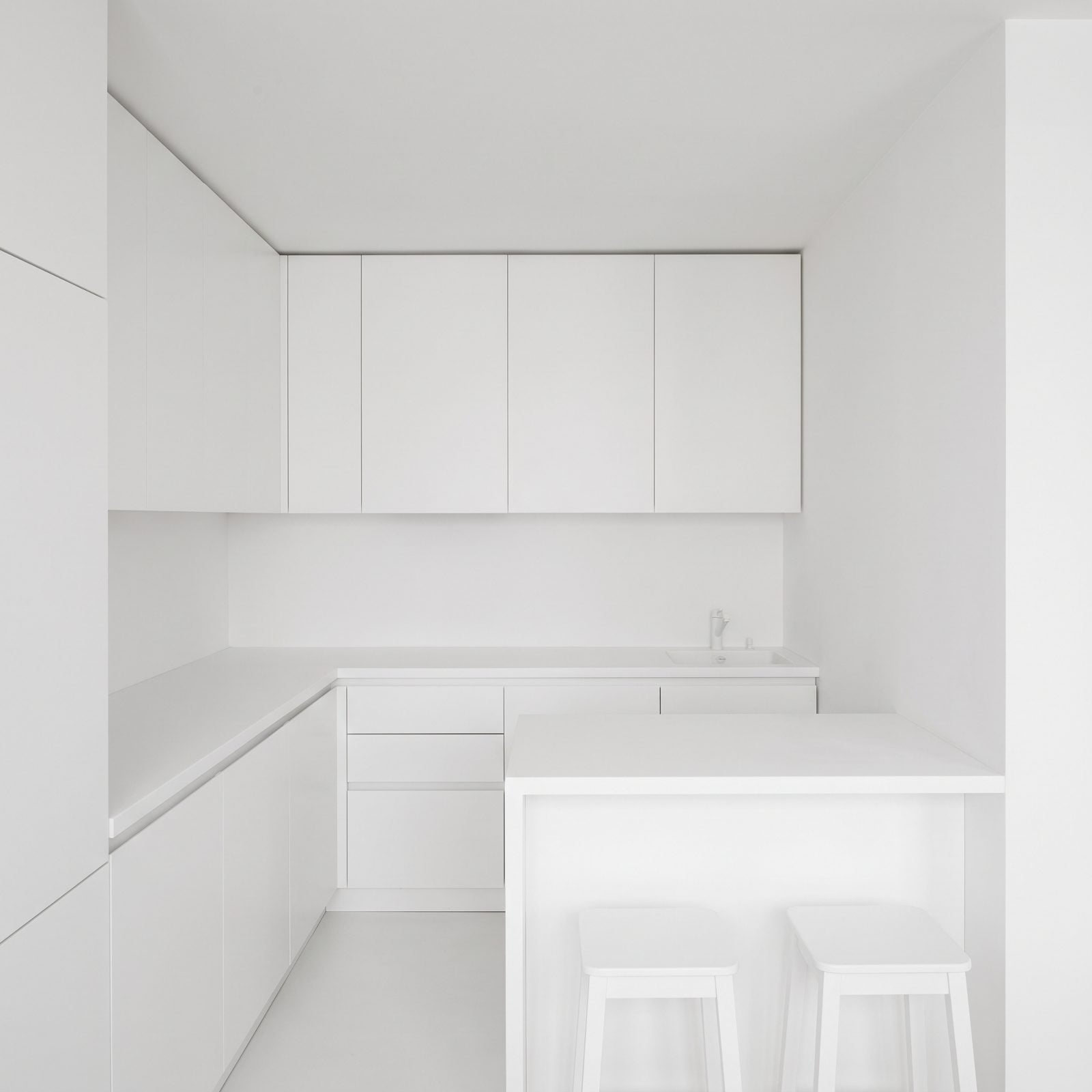 White Cabinets Making a Tiny Kitchen Feel Like a Blank Box