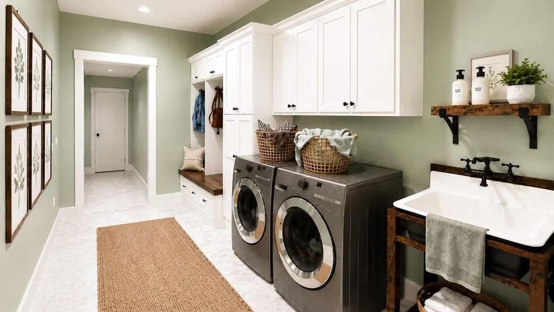 Sage Green Laundry Room With a Mudroom Built Right Into the Wall