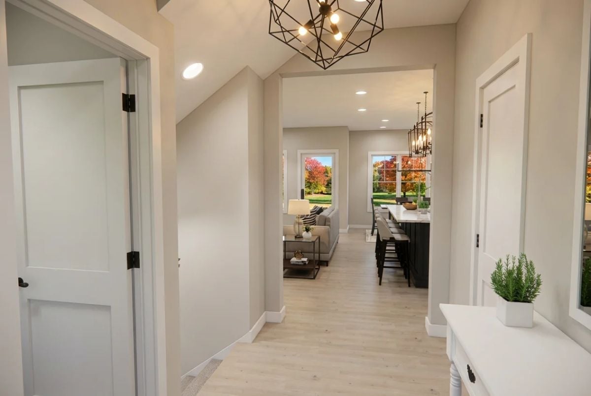 Geometric Pendant, Warm Wood Floors, and a Hallway That Pulls You Straight Through