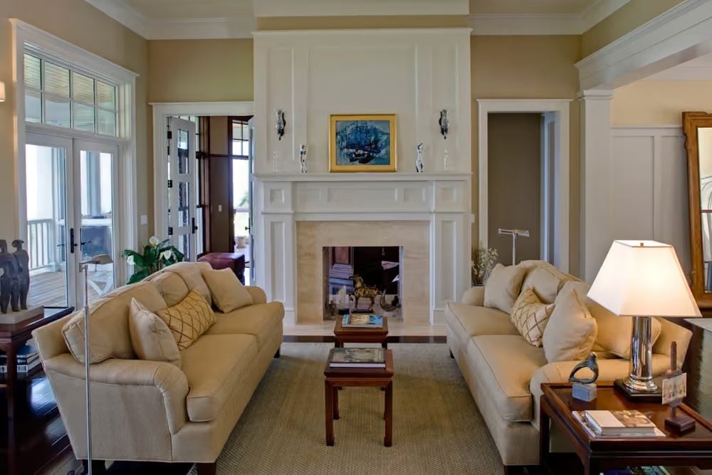 Paired Sofas Facing a White Fireplace Wall Make the Room Work for Everyone