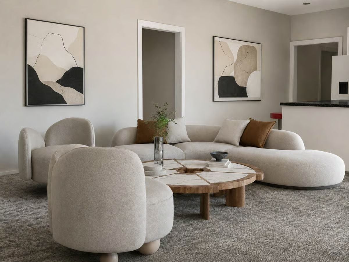 Curved Furniture and a Round Coffee Table That Earns Its Keep