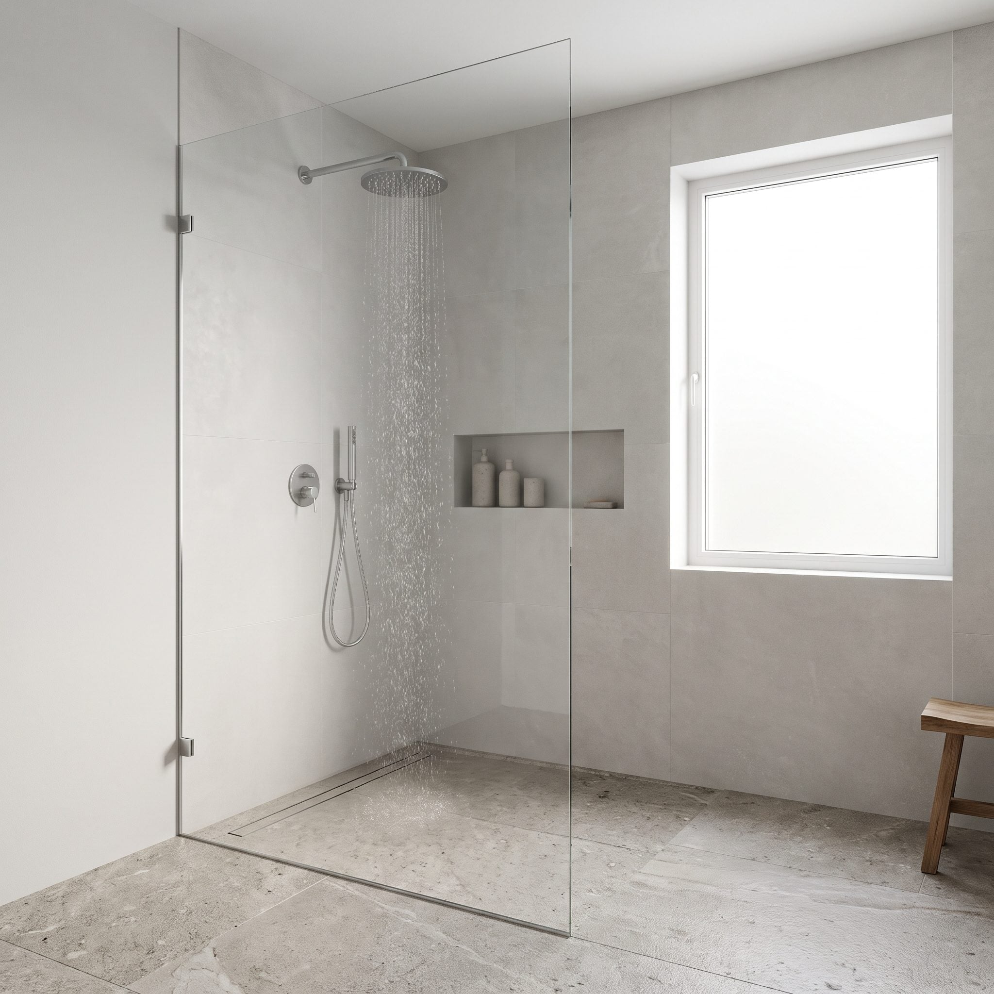 Bathroom with a single fixed glass panel defining a doorless walk-in shower