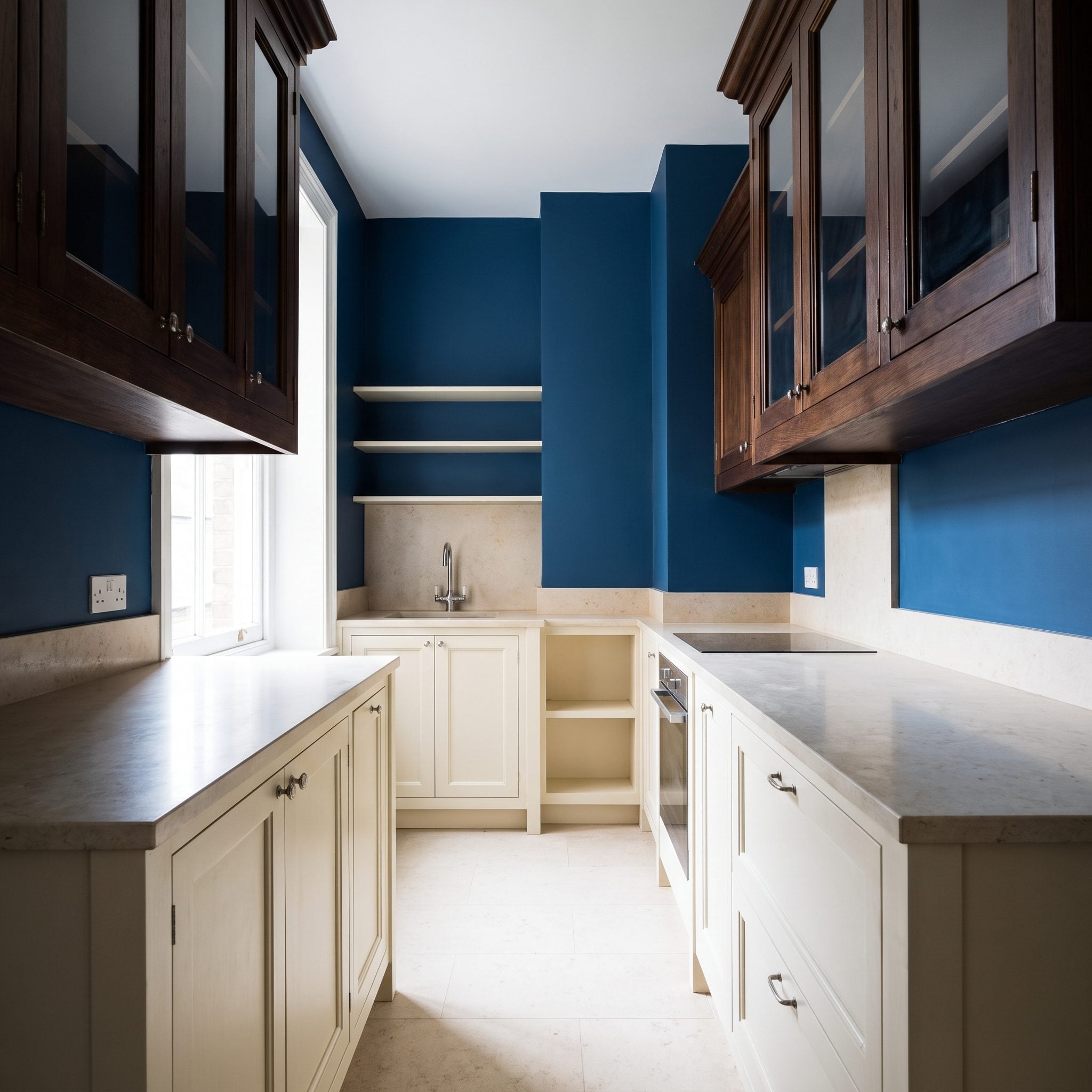 Before-and-after two-tone kitchen with pale linen upper cabinets and deep cocoa lower cabinets
